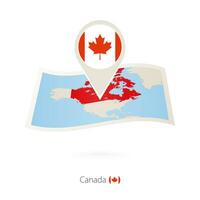 Folded paper map of Canada with flag pin of Canada. vector
