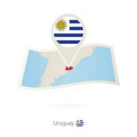 Folded paper map of Uruguay with flag pin of Uruguay. vector
