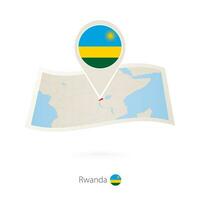 doblada papel mapa de Ruanda con bandera alfiler de Ruanda vector