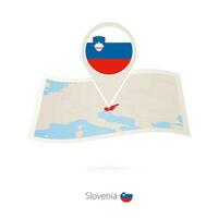 Folded paper map of Slovenia with flag pin of Slovenia. vector