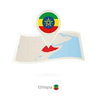 Folded paper map of Ethiopia with flag pin of Ethiopia. vector