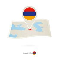 doblada papel mapa de Armenia con bandera alfiler de Armenia. vector