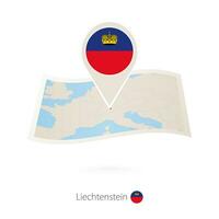 Folded paper map of Liechtenstein with flag pin of Liechtenstein. vector