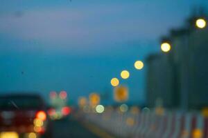 Bokeh, bright shining lights of the district in the nighttime rush hour on blurred background. photo