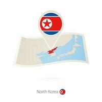 Folded paper map of North Korea with flag pin of North Korea. vector