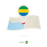 Folded paper map of Gabon with flag pin of Gabon. vector