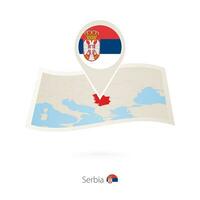 Folded paper map of Serbia with flag pin of Serbia. vector