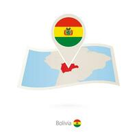 Folded paper map of Bolivia with flag pin of Bolivia. vector