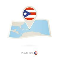 Folded paper map of Puerto Rico with flag pin of Puerto Rico. vector