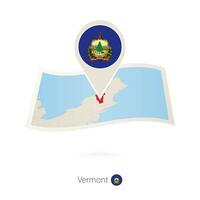 Folded paper map of Vermont U.S. State with flag pin of Vermont. vector