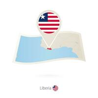 Folded paper map of Liberia with flag pin of Liberia. vector