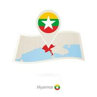 Folded paper map of Myanmar with flag pin of Myanmar. vector