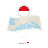 Folded paper map of Monaco with flag pin of Monaco. vector