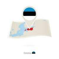 Folded paper map of Estonia with flag pin of Estonia. vector