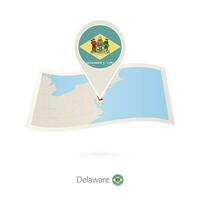 doblada papel mapa de Delaware nos estado con bandera alfiler de Delaware. vector