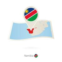 Folded paper map of Namibia with flag pin of Namibia. vector