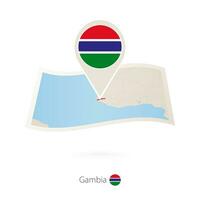 doblada papel mapa de Gambia con bandera alfiler de Gambia. vector