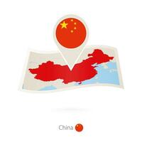 Folded paper map of China with flag pin of China. vector