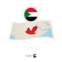 Folded paper map of Sudan with flag pin of Sudan. vector