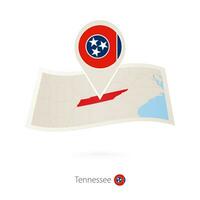 Folded paper map of Tennessee U.S. State with flag pin of Tennessee. vector