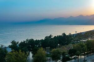 evening view of Konyaalti beach and coastal park in Antalya, Turkey photo