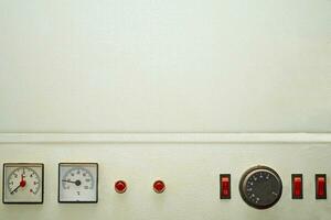 Water boiler with control sensors and power,adjustment buttons in the basement photo