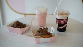 Blueberry Drink and Cinamon Roll Chocolate cake or Dessert on the table photo