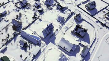 Beautiful winter village. Clip. A snowy area with small houses where it is very quiet. photo