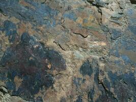 Black stone background. Long black stone texture and textured. Dirty black stone wall. Rock texture with cracks. stone tile floor texture. Old wall texture abstract natural background. photo