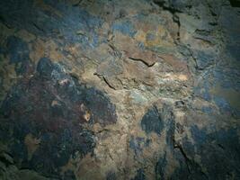 Black stone background. Long black stone texture and textured. Dirty black stone wall. Rock texture with cracks. stone tile floor texture. Old wall texture abstract natural background. photo