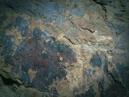 Black stone background. Long black stone texture and textured. Dirty black stone wall. Rock texture with cracks. stone tile floor texture. Old wall texture abstract natural background. photo