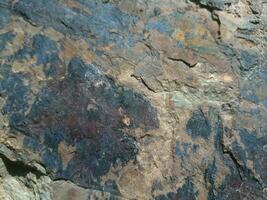 Black stone background. Long black stone texture and textured. Dirty black stone wall. Rock texture with cracks. stone tile floor texture. Old wall texture abstract natural background. photo