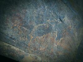 Black stone background. Long black stone texture and textured. Dirty black stone wall. Rock texture with cracks. stone tile floor texture. Old wall texture abstract natural background. photo