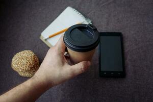 Pencil, notebook and paper coffee cup photo