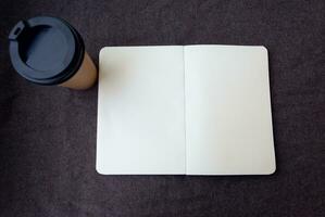 Pencil, notebook and paper coffee cup photo