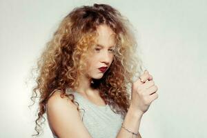 Beauty young woman with curly big and long hair. photo