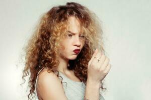 Beauty young woman with curly big and long hair. photo