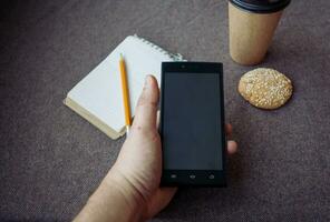 Pencil, notebook and paper coffee cup photo