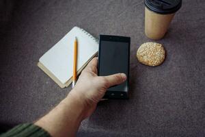 Pencil, notebook and paper coffee cup photo