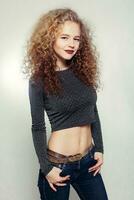 Beauty young woman with curly big and long hair. photo