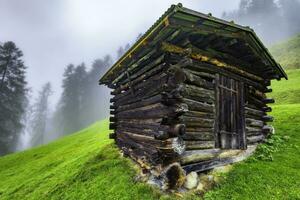 Wooden hayloft in the Stubai Alps photo