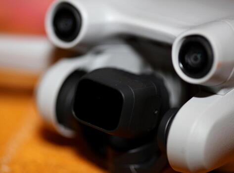 Macro view drone sensor and drone propeller focus is on second propeller droning concept video film making operator rent equipment backgrounds high quality footage photo