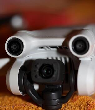 Macro view drone sensor and drone propeller focus is on second propeller droning concept video film making operator rent equipment backgrounds high quality footage photo