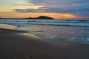 Colorful sunrise on the coast of the South China Sea. photo