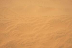 The texture of sand in the desert as a natural background. photo