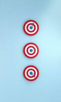 Row dart hitting target on blue background. Bullseye success concept. Vertical Size. photo
