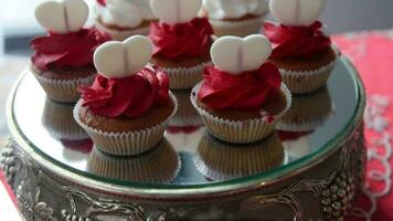 Appetizing, sweet, delicious cakes on a red table video