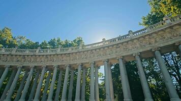 The sun's rays sparkle through the opening of the colonnade. Colonnade of Monument to King Alfonso XII in Buen Retiro Park in central Madrid, Spain, Europe. video