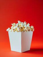 AI generated blank pop corn box mockup in plain red isolated background photo