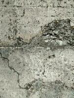 grieta hormigón pared. antiguo sucio agrietado pared textura foto